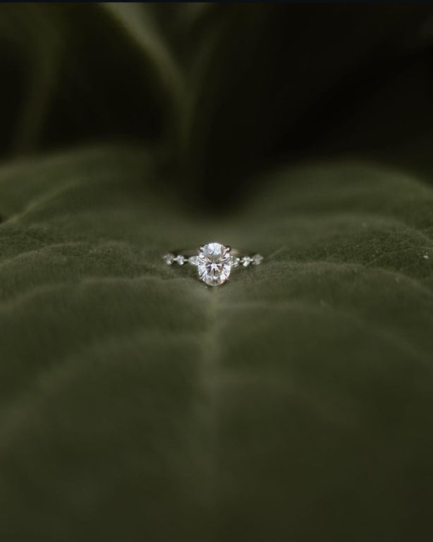 Oval diamond ring on hand