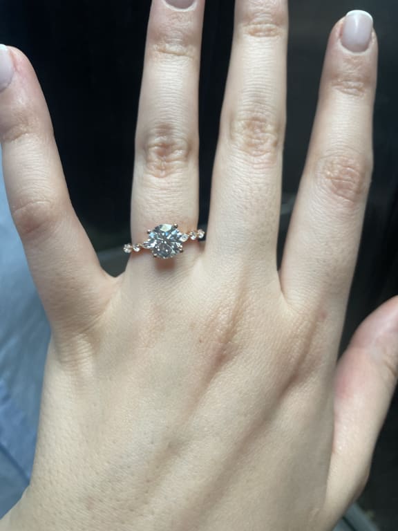 Oval diamond ring on hand