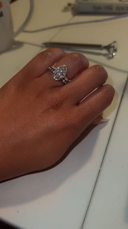 Oval diamond ring on hand