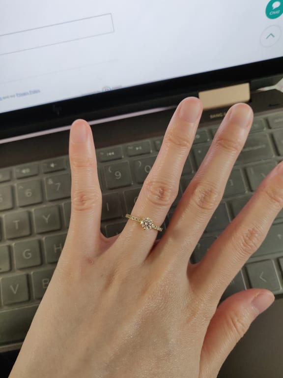 Oval diamond ring on hand