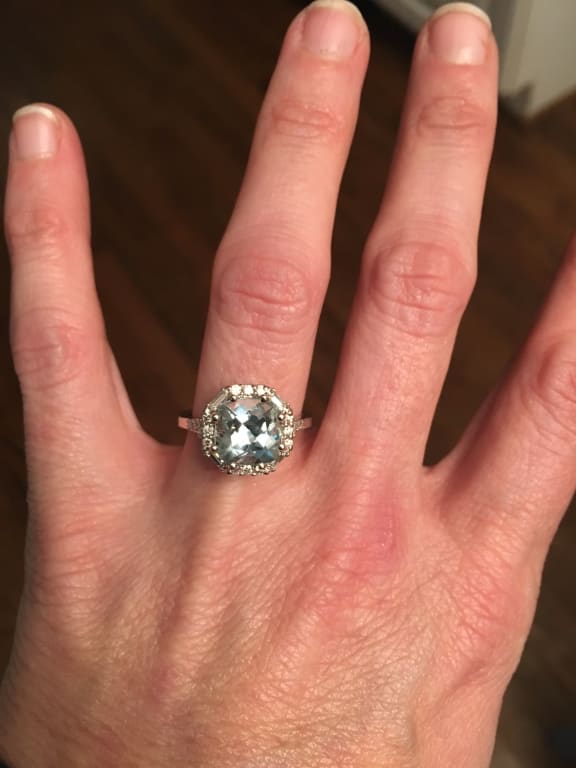 Oval diamond ring on hand