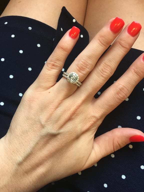 Oval diamond ring on hand