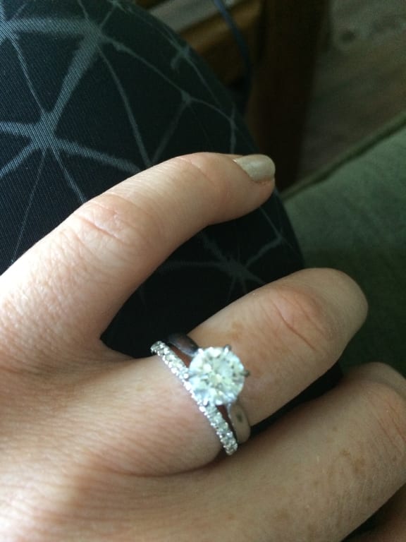 Oval diamond ring on hand