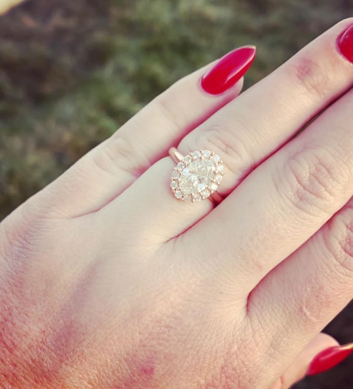 Oval diamond ring on hand