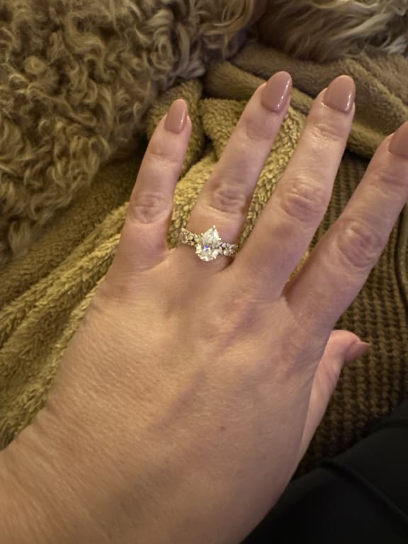 Oval diamond ring on hand