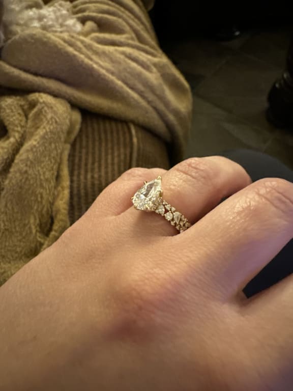 Oval diamond ring on hand