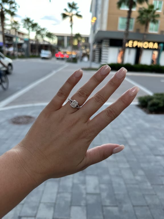 Oval diamond ring on hand
