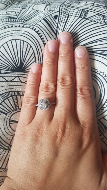 Oval diamond ring on hand