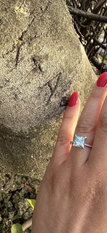 Oval diamond ring on hand