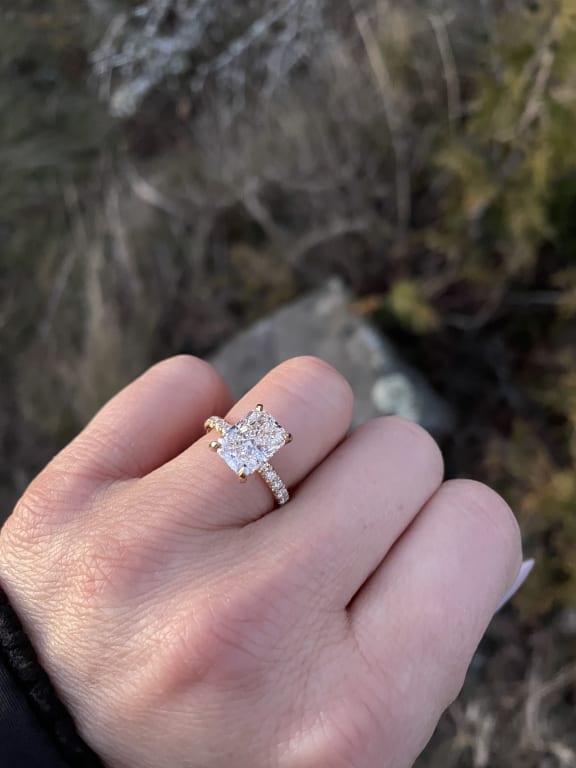 Oval diamond ring on hand