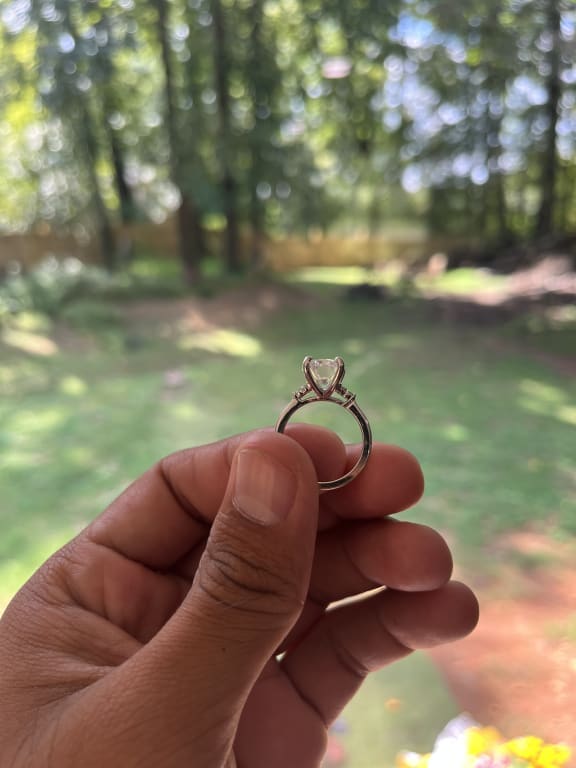 Oval diamond ring on hand