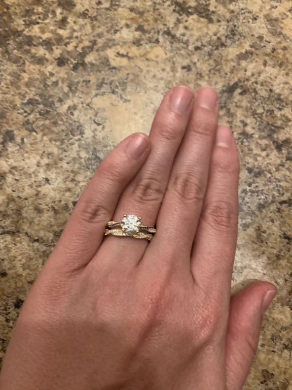 Oval diamond ring on hand