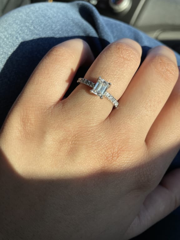 Oval diamond ring on hand