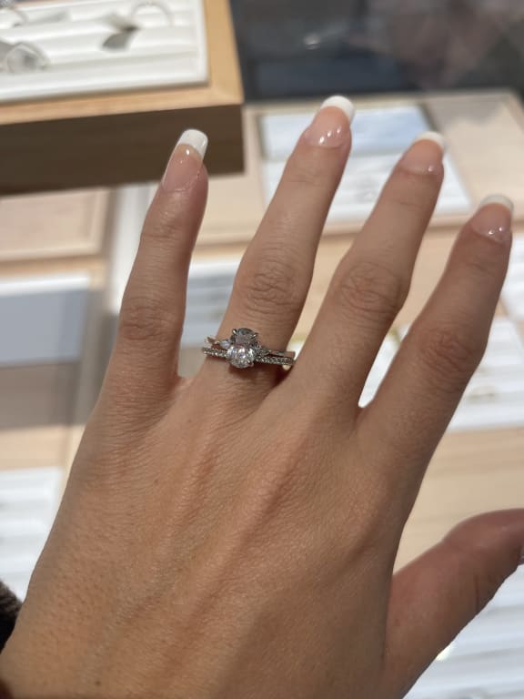 Oval diamond ring on hand