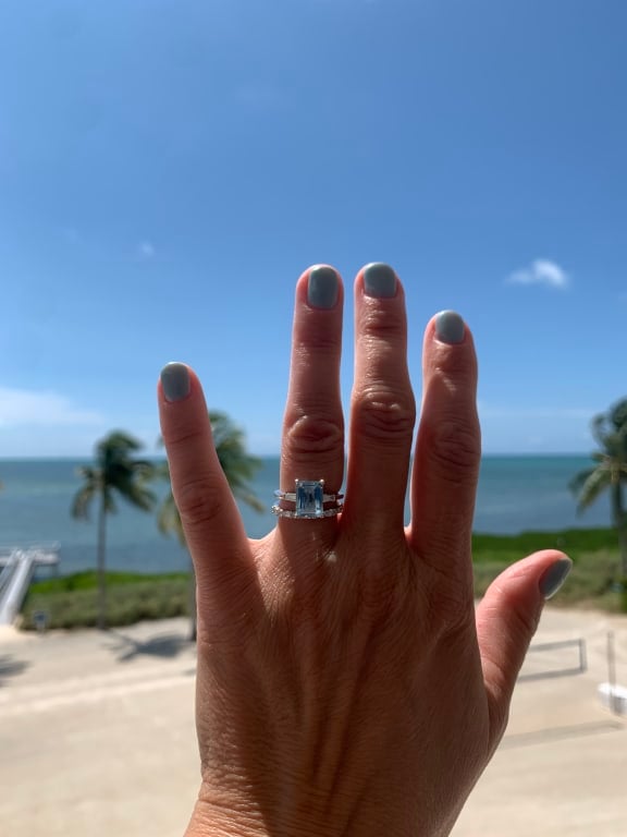 Oval diamond ring on hand