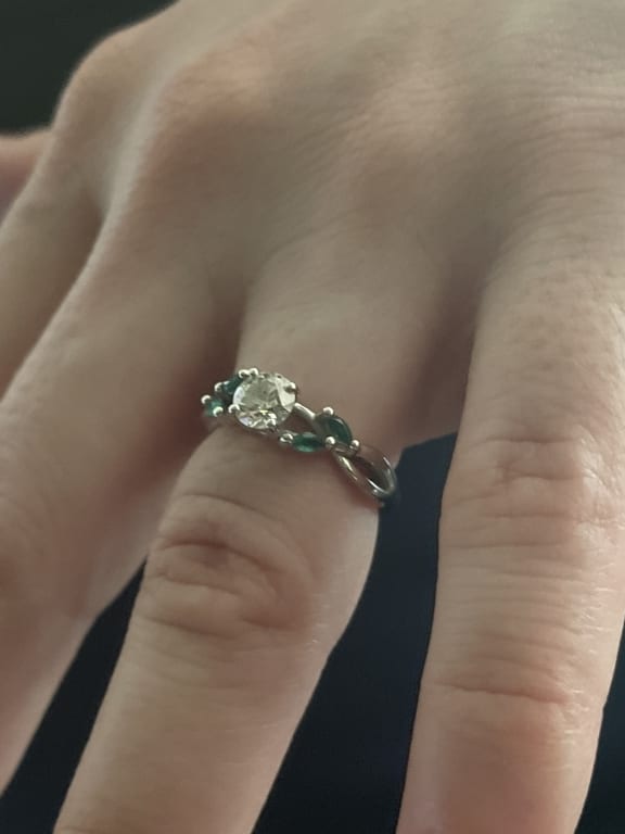 Oval diamond ring on hand