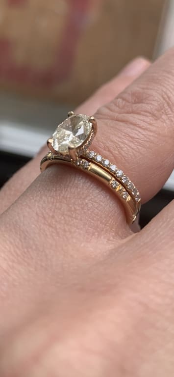 Oval diamond ring on hand