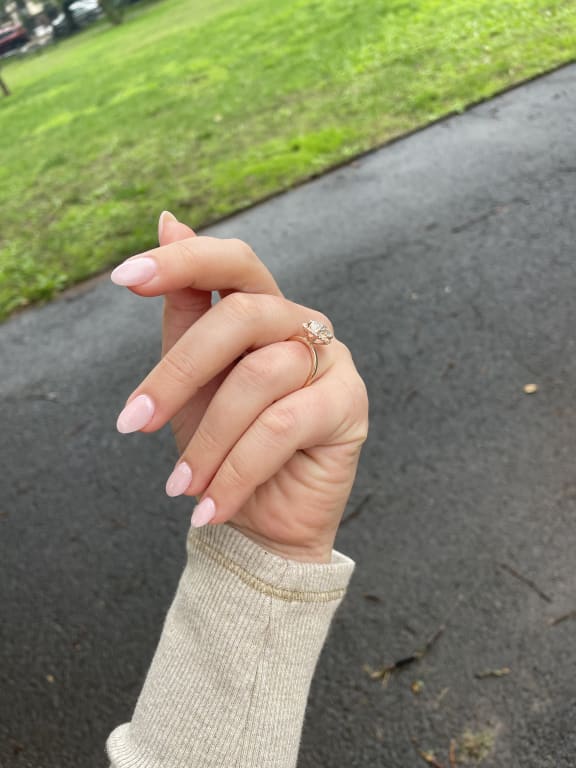 Oval diamond ring on hand