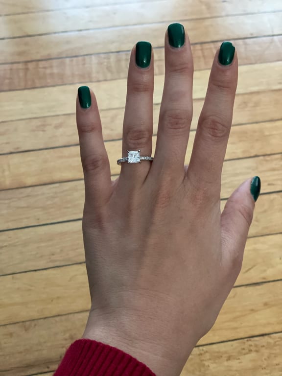 Oval diamond ring on hand