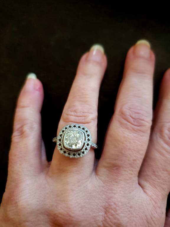 Oval diamond ring on hand