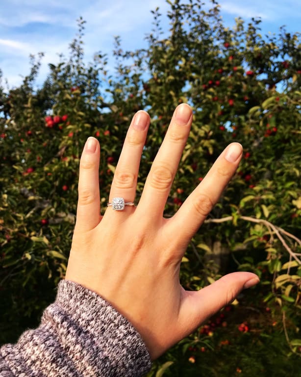 Oval diamond ring on hand