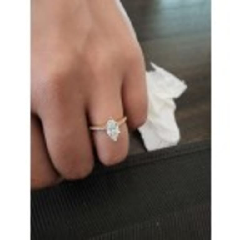 Oval diamond ring on hand
