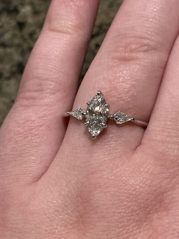 Oval diamond ring on hand