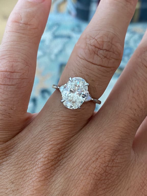 Oval diamond ring on hand