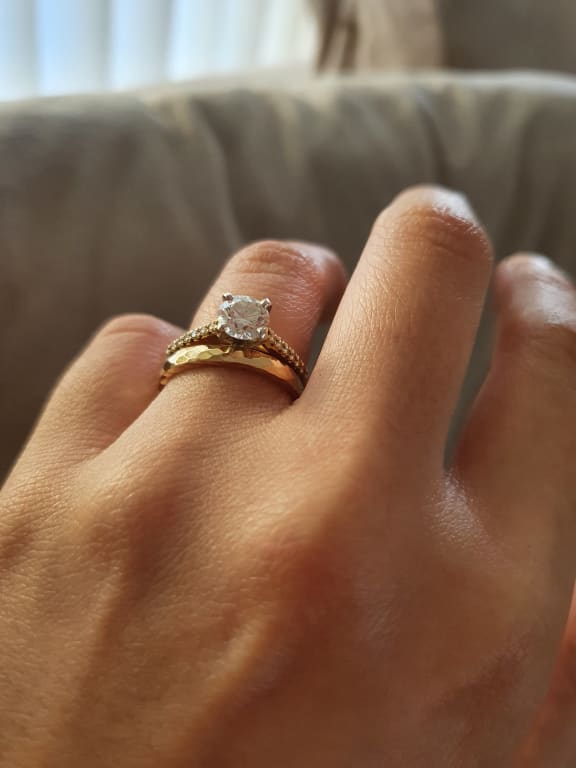 Oval diamond ring on hand