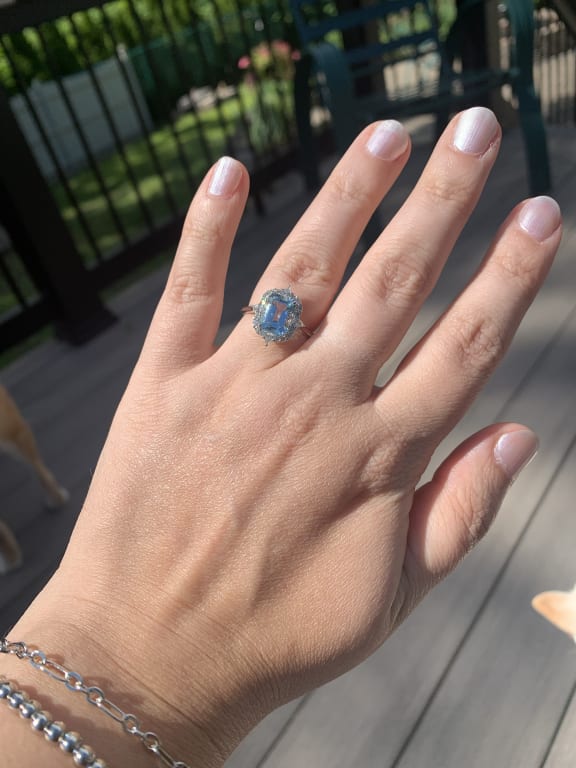 Oval diamond ring on hand