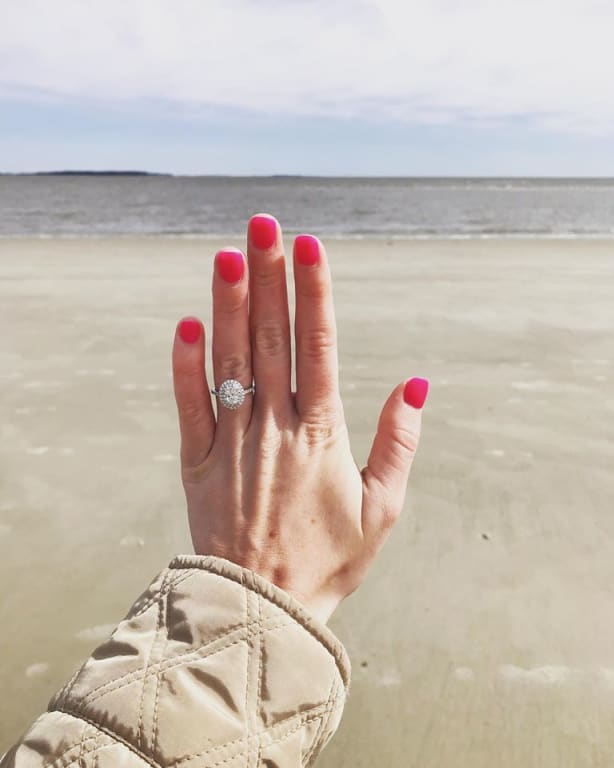 Oval diamond ring on hand