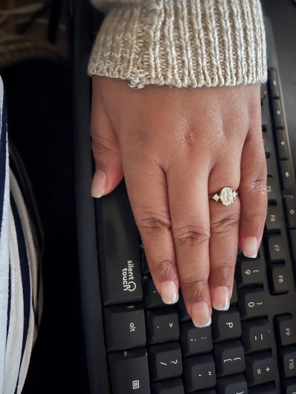 Oval diamond ring on hand