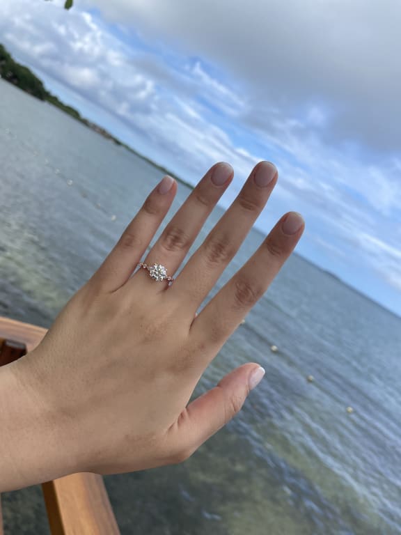 Oval diamond ring on hand