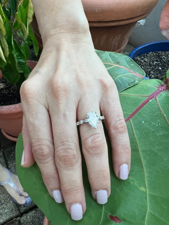 Oval diamond ring on hand