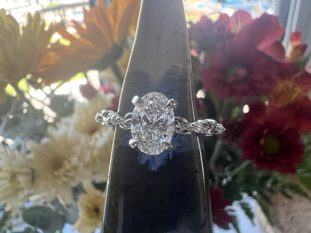 Oval diamond ring on hand