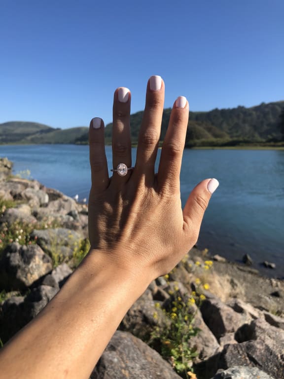 Oval diamond ring on hand