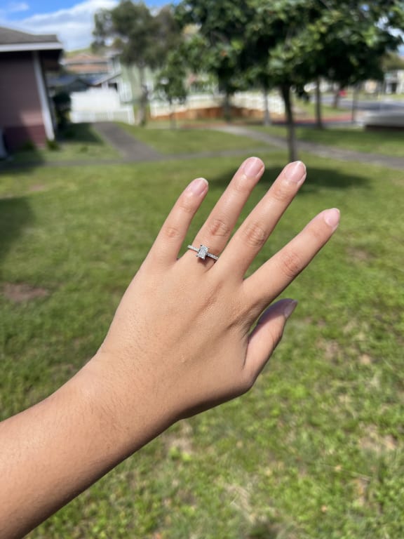 Oval diamond ring on hand