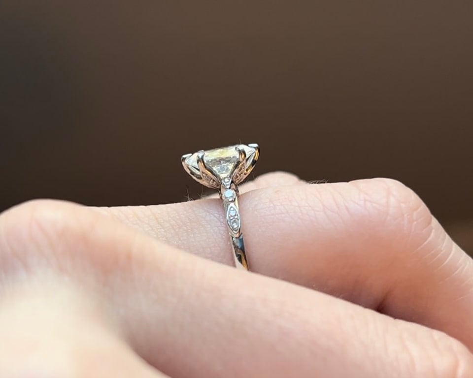 Oval diamond ring on hand