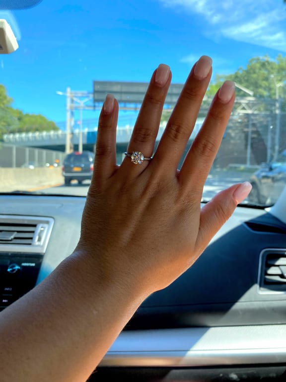 Oval diamond ring on hand