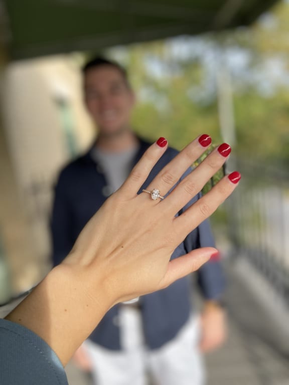 Oval diamond ring on hand