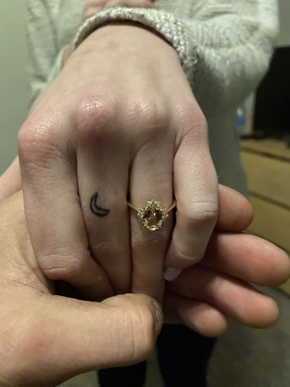 Oval diamond ring on hand