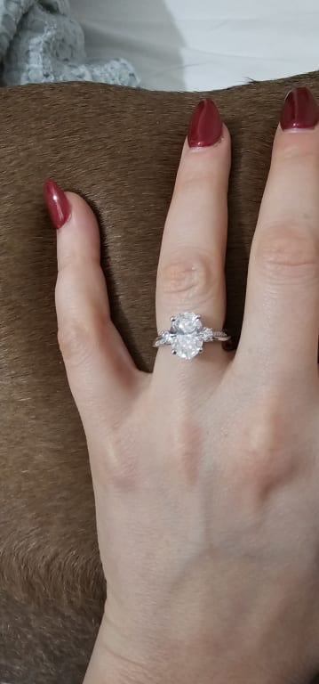 Oval diamond ring on hand