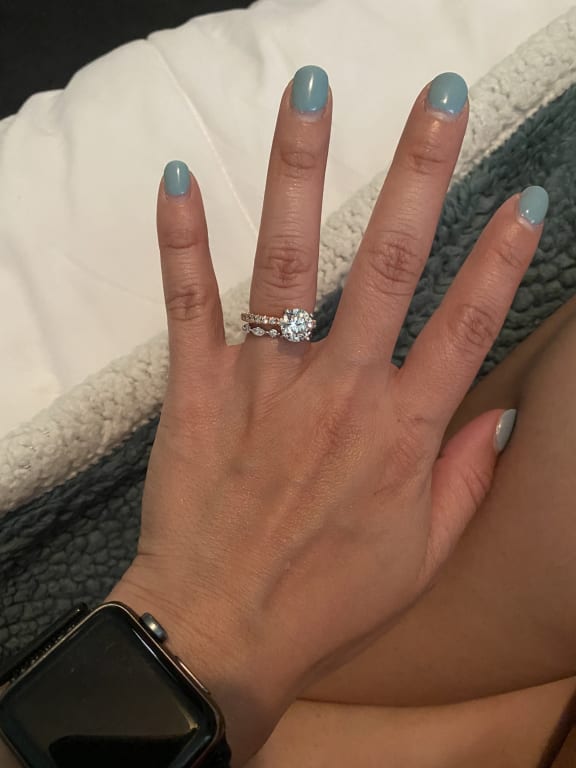Oval diamond ring on hand