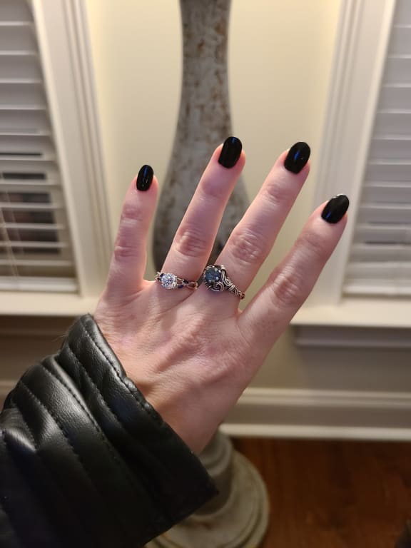 Oval diamond ring on hand