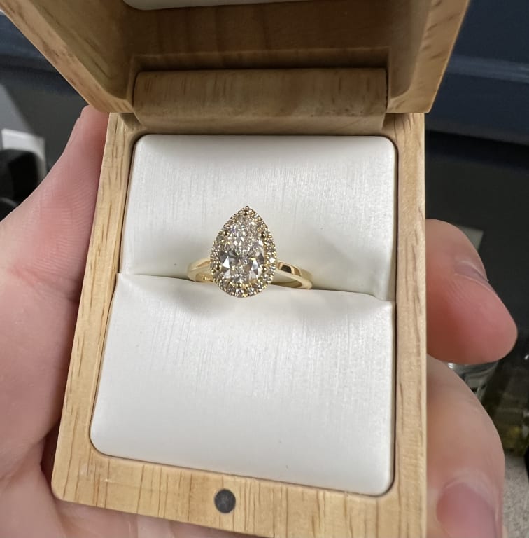 Oval diamond ring on hand