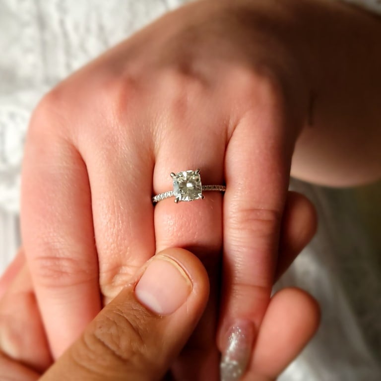 Oval diamond ring on hand