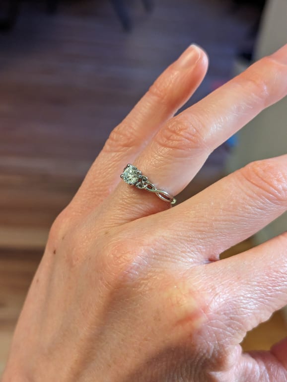 Oval diamond ring on hand