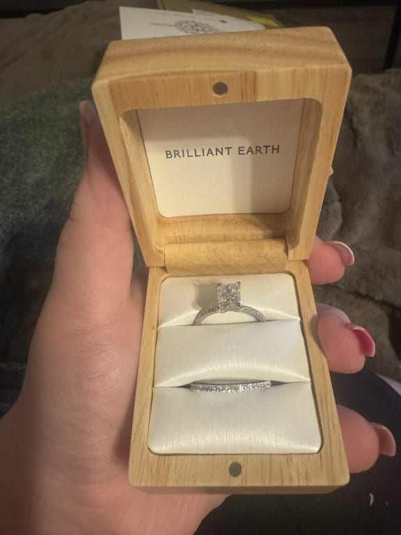 Oval diamond ring on hand