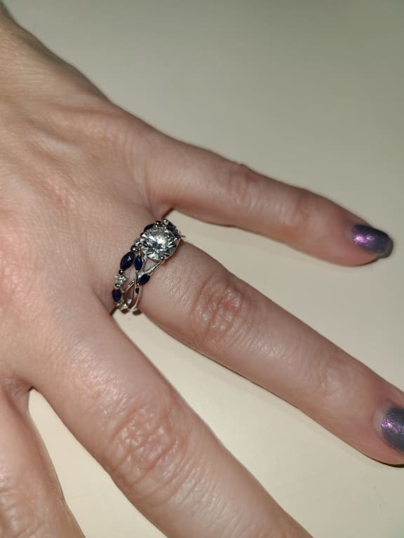 Oval diamond ring on hand