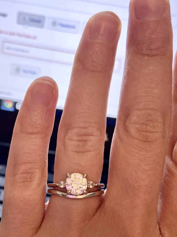 Oval diamond ring on hand